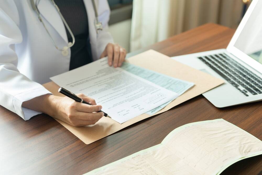 Doctor reviewing patient documentation
