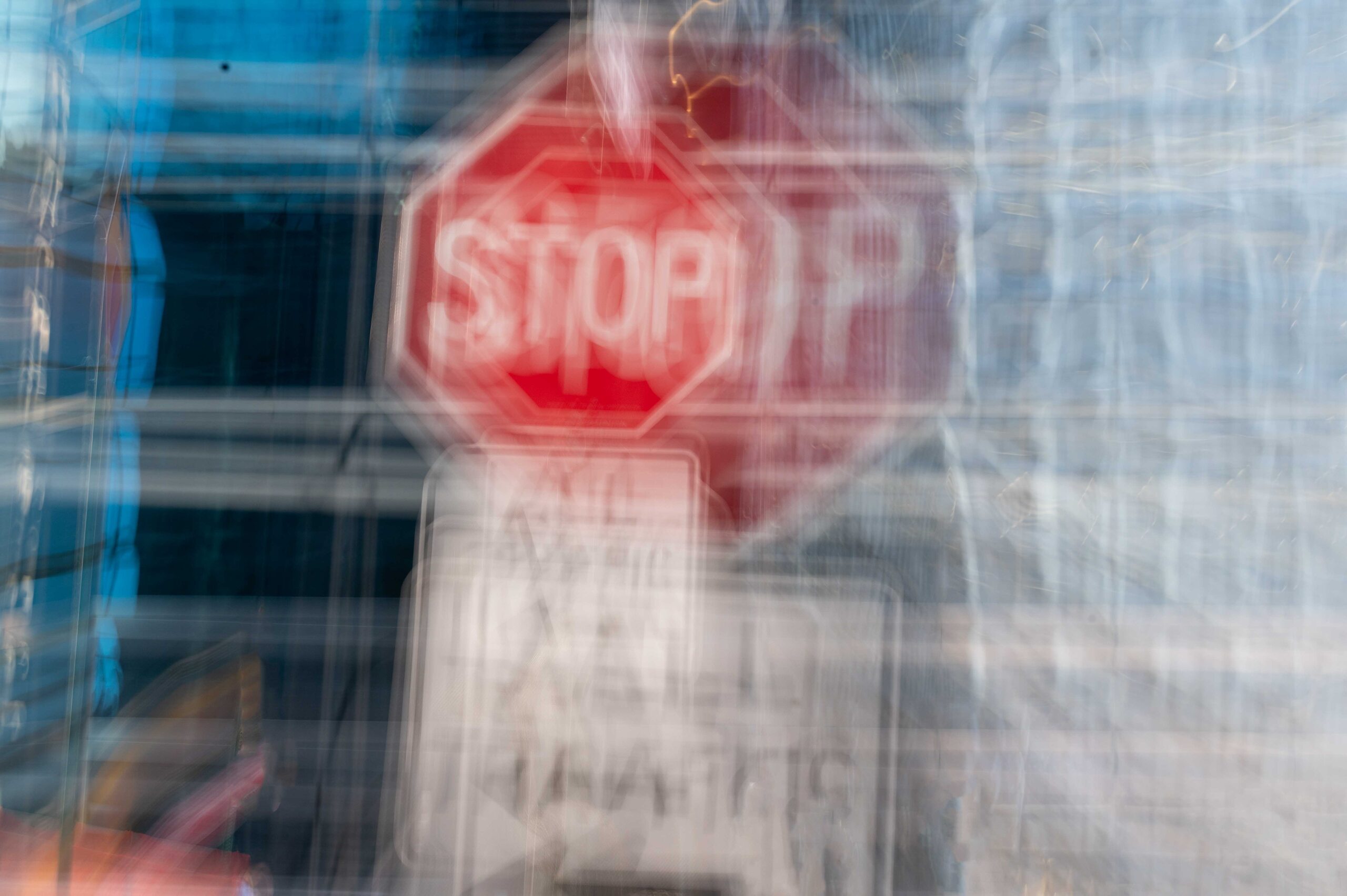 Blurry, double-vision stop sign representing drunk driving hazards in St. Louis.