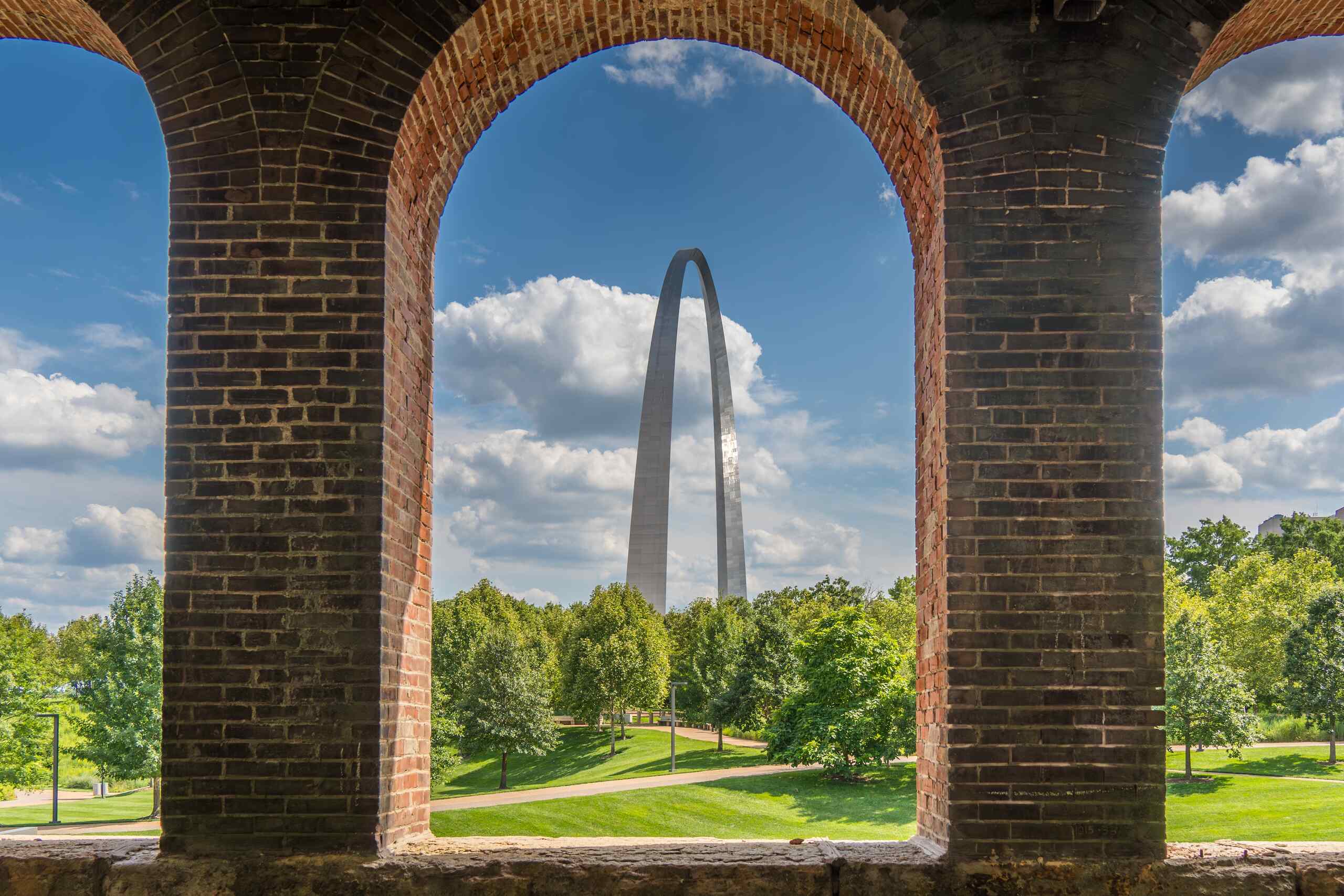 St. Louis Gateway Arch framed by brick arches, represented by St. Louis Hit and Run Accident Lawyers.